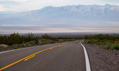 Scenic Road Through Death Valley with Mountain Backdrop
