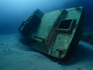 a boat wreck underwater metal on ocean floor 