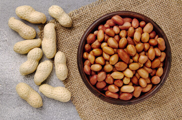 Organic Raw Peanuts in a Bowl on grey table