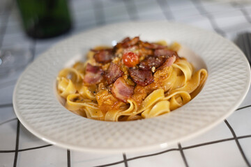 Fettuccine Pasta With Bacon And Red Sauce