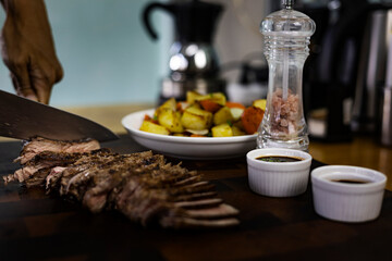Slice The Beef Steak On A Wooden Cutting Board