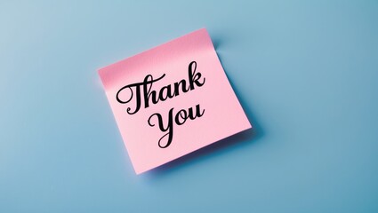 Message of gratitude on a sticky note placed against a blue background