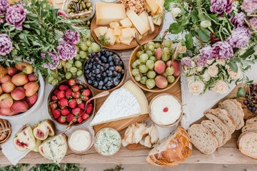 Elegant charcuterie board with cheese assortment fresh fruits and bread rustic charm and vibrant colors appetizing display