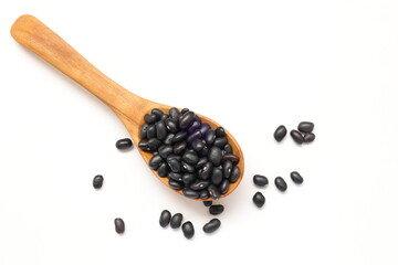 black bean on wooden spoon