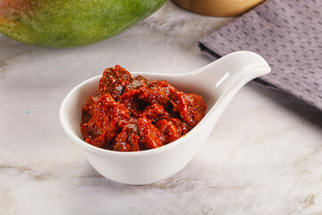 Spicy pickled raw green mango