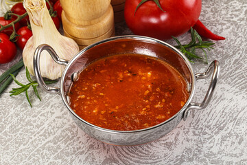 Hot tomato soup with diced chicken