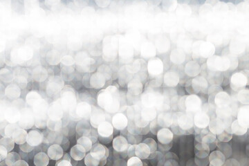 Abstract blurred grey light bokeh background, festive season concept background, grey bokeh pattern background