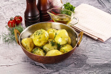 Young boiled potato with dill