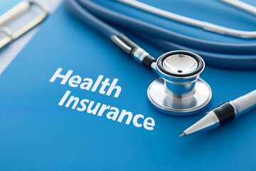 Health insurance document with a stethoscope on a blue background, medical protection concept
