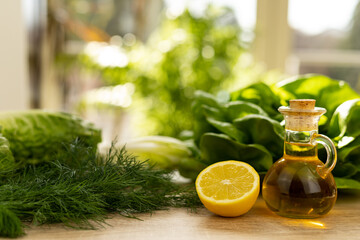 Lemon, dill close-up on the table. Ingredients for salad. Healthy food