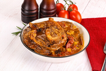 Italian cuisine - ossobuco with sauce