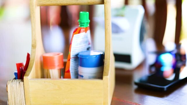 Hand Grabs Seasoning Bottle in Phuket Restaurant