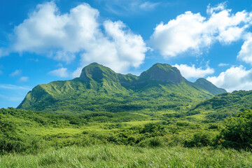 Fototapeta premium Beautiful green mountains with a blue sky background. Stunning nature landscape of a mountain view Generative AI