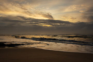 Wild coast beach at sunrise