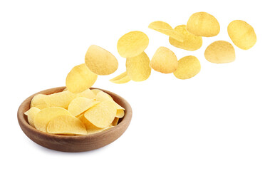 Tasty potato chips falling into bowl on white background