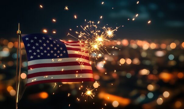 American flag with fireworks sparks against blurred city lights background