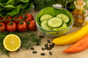The process of making a vegetable salad. Healthy food. Cucumber salad