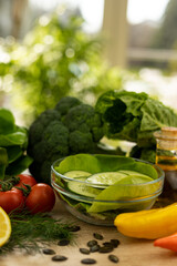 Paprika, chopped cucumbers on the table. The process of preparing a salad
