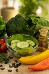 Paprika, chopped cucumbers on the table. The process of preparing a salad