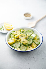 Homemade potato salad with cucumber and lemon