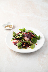 Herring salad with beetroot and spinach