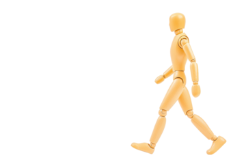 wooden mannequin is depicted walking with confident stride, showcasing human like movement. figure is articulated, allowing for various poses, and is set against plain background, emphasizing its