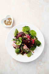Herring salad with beetroot and spinach