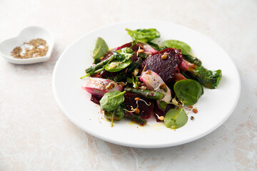 Herring salad with beetroot and spinach