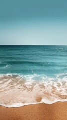 Tranquil Seascape with Gentle Waves and Sandy Beach at Sunrise