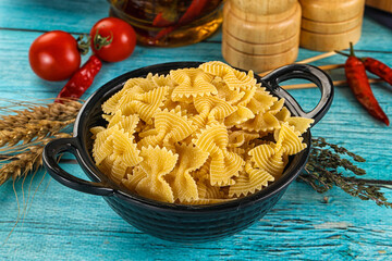 Raw dry farfalle for cooking
