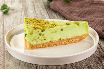 Green pistachio cheesecake served mint