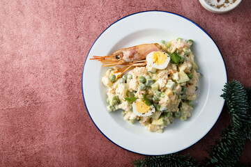 Russian salad with shrimps and avocado