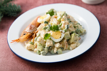 Russian salad with shrimps and avocado