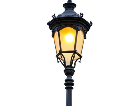 Vintage street lamp illuminating a quiet evening sidewalk on a transparent background, cut out