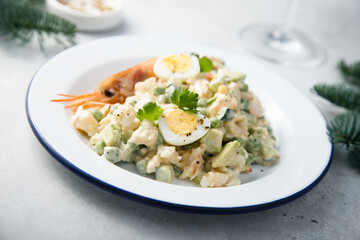 Russian salad with shrimps and avocado
