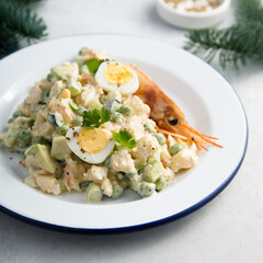 Russian salad with shrimps and avocado