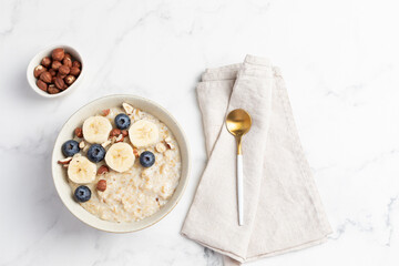Oatmeal Bowl, Oat Porridge with berries, Banana and nuts in a Bowl, Healthy Snack or Breakfast