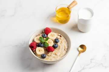Oatmeal Bowl, Oat Porridge with berries, Banana and nuts in a Bowl, Healthy Snack or Breakfast