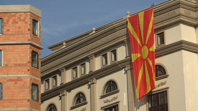 Macedonian national flag on government building under construction in Skopje
