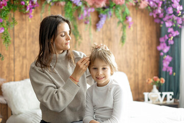 Mother, checking her sons hair for lice, precautions child hair
