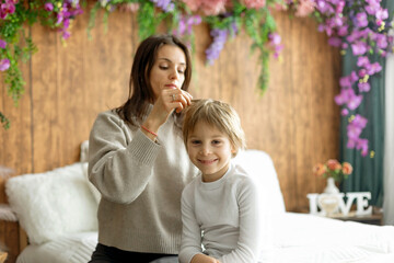 Mother, checking her sons hair for lice, precautions child hair