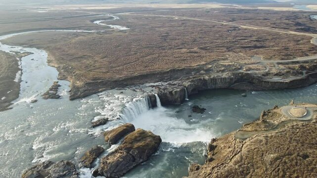 aerial footage of golden hour godafoss waterfall in iceland