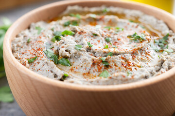 Traditional baba ganoush in bowl on wooden table. Close up