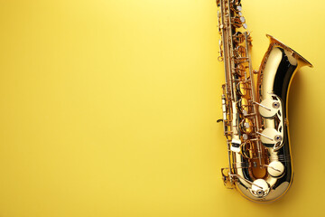 Jazz. One saxophone on yellow background, top view. Space for text