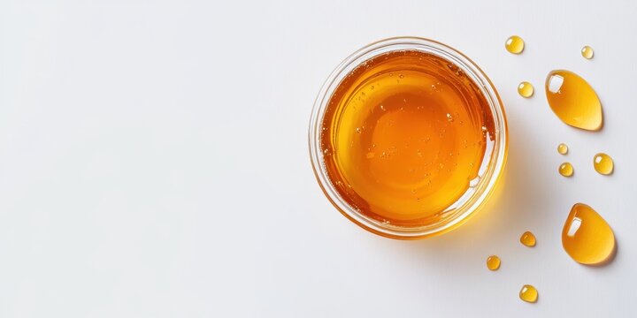 Golden Nectar: A captivating shot of honey in a glass bowl with dripped honey , showcasing its rich color and inviting texture. Perfect for culinary, health, and nature-related projects.
