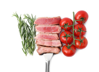 Delicious sliced beef tenderloin with different degrees of doneness, rosemary and tomatoes isolated on white, top view