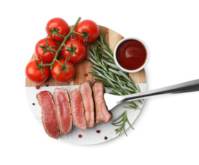 Delicious sliced beef tenderloin with different degrees of doneness, tomatoes, sauce and spices isolated on white, top view