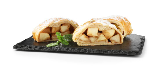 Pieces of tasty apple strudel with powdered sugar and mint isolated on white
