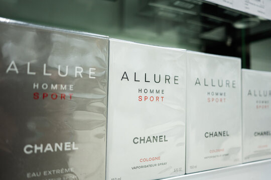 Chanel allure homme sport colognes on display in a retail store setting