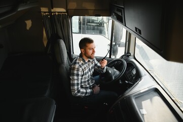 Semi truck driver and walkie-talkie in cabin truck
